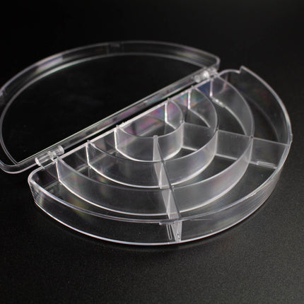A clear plastic container with multiple compartments, designed for organizing and storing various items.