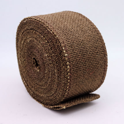 A brown burlap roll with a textured surface, sitting on a white background.
