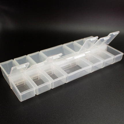 A clear plastic container with multiple compartments, designed for organizing and storing small items.