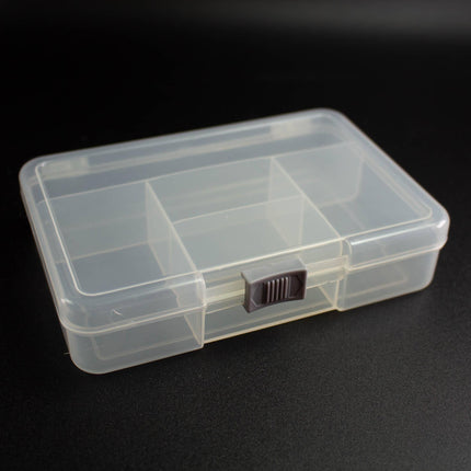 A clear plastic container with multiple compartments is shown against a black background.