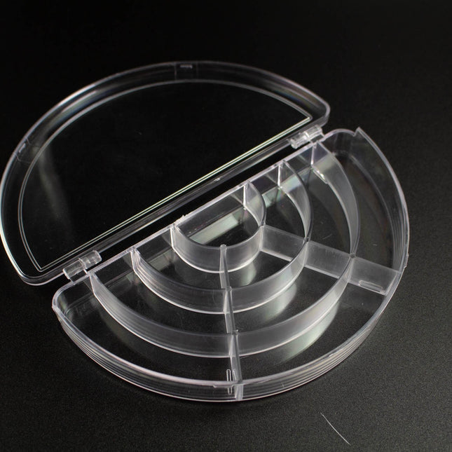 A clear plastic container with multiple compartments, designed to hold and organize various items.