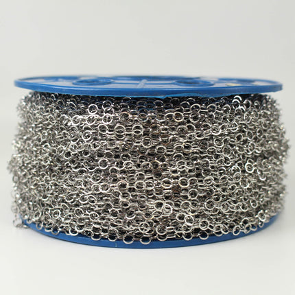 A spool of silver-colored metal chain with a blue plastic spool at the top.