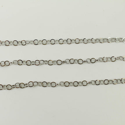 a close-up view of three silver-colored metal chains arranged in a row on a white background.