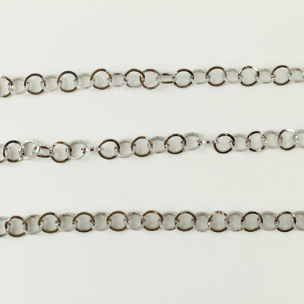 a close-up view of three silver-colored metal chains arranged in a row.