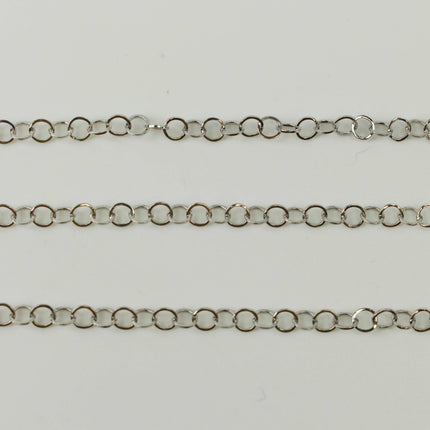 A close-up view of a silver chain with multiple links arranged in a row.