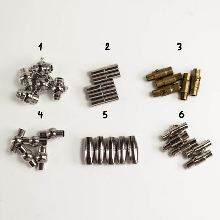 a collection of various metal components, including nuts, bolts, and other hardware items, arranged in a grid-like pattern.