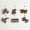 a collection of various metal components, including nuts, bolts, and other hardware items, arranged in a grid-like pattern.