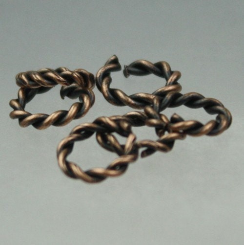 50 pcs of Antique Brass plated Twisted jumpring - 10mm